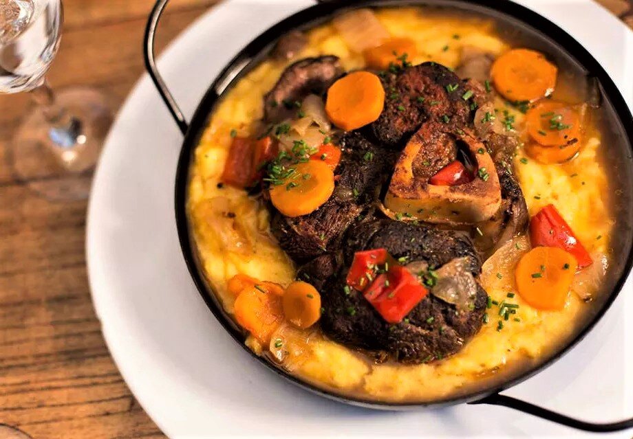 A  plate of polenta and osso buco at El Peron Peron in Buenos Aires, Argentina