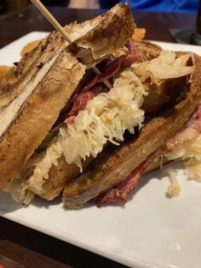 Handheld Reuben with crispy rings