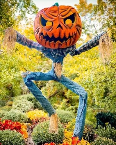 Scarecrpw with pumpkin head at Atlanta Botanical