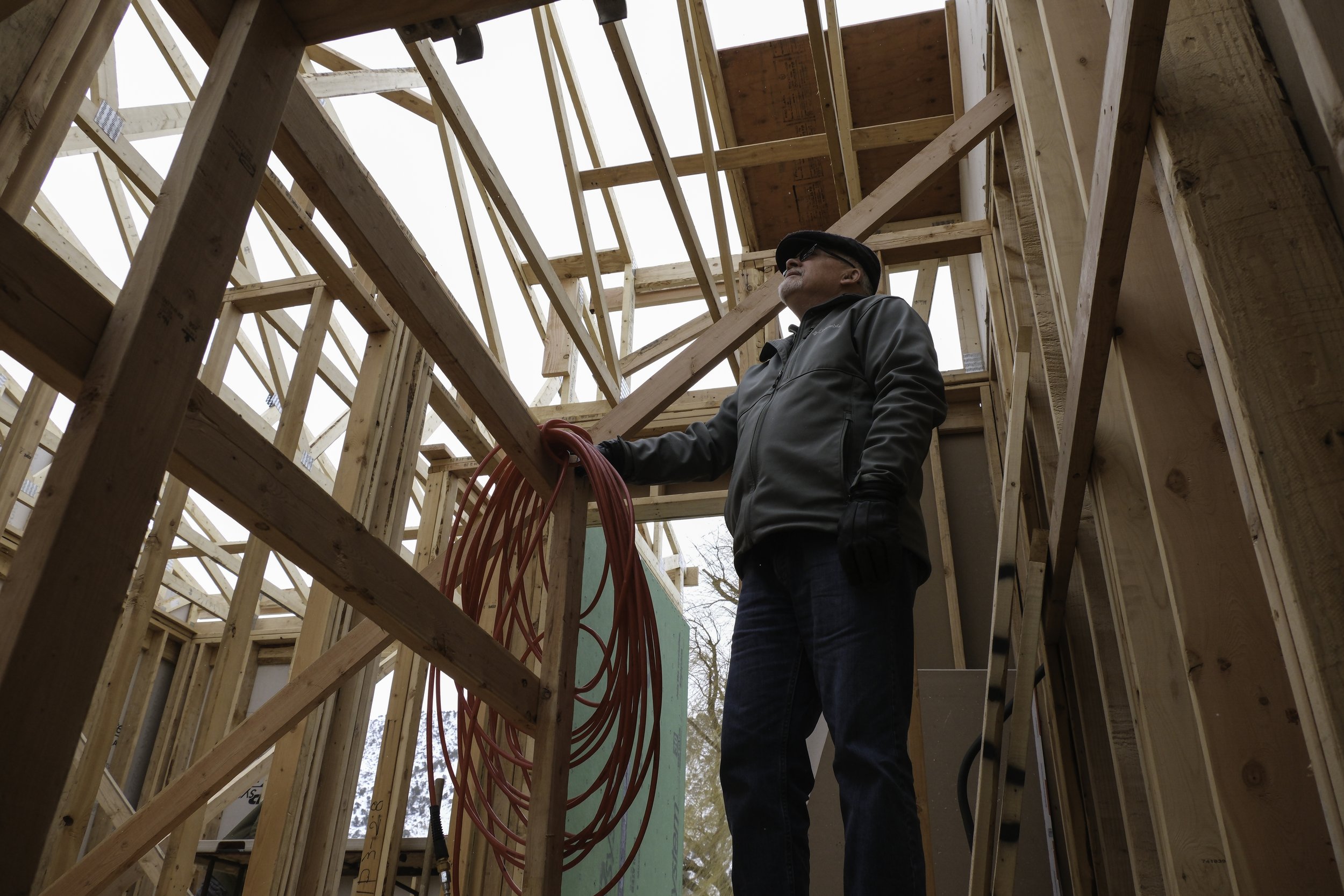 Future resident of net-zero development surveys new unit, shot for High Country News