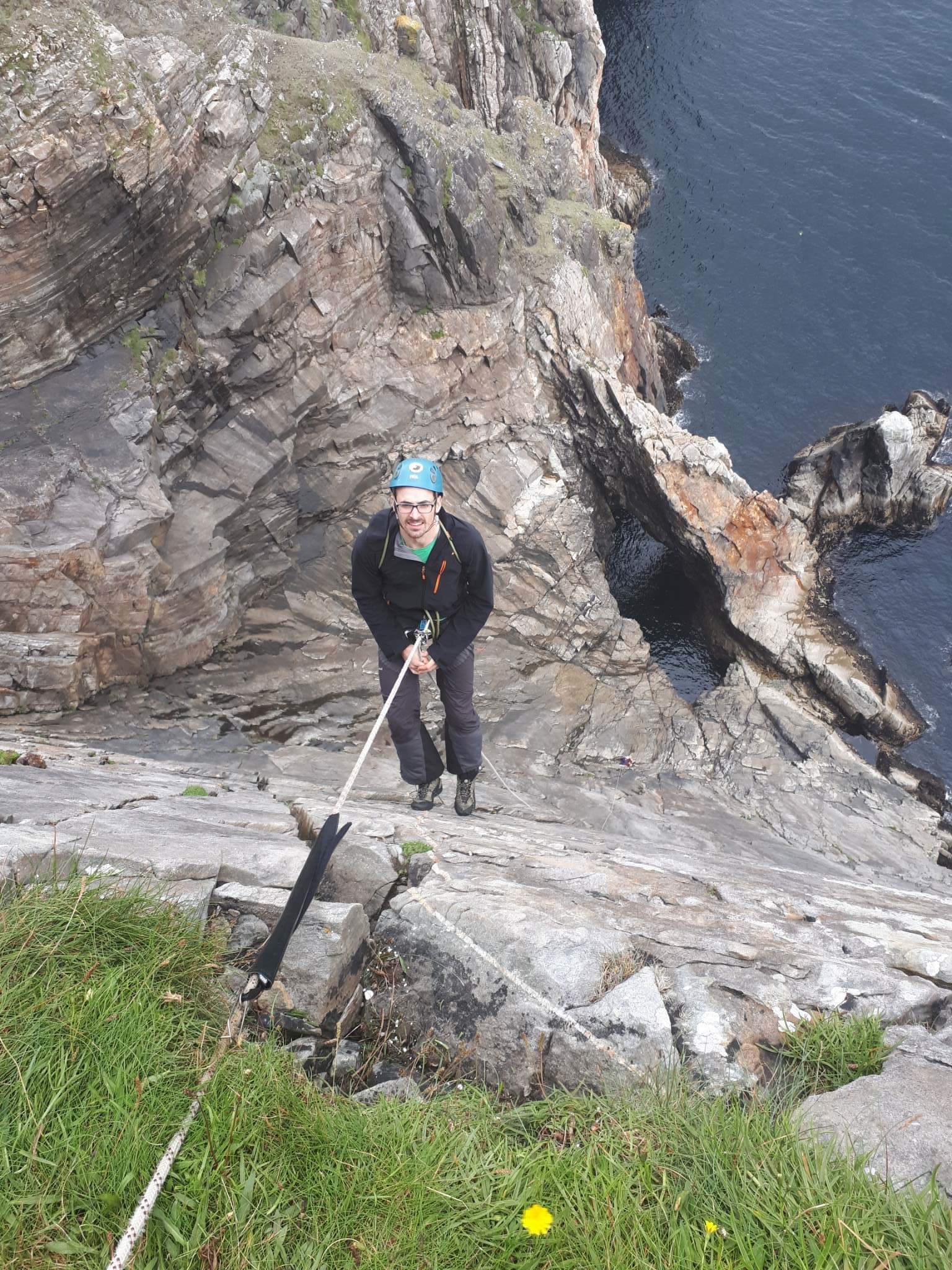 Kyle abseiling into Sail Rock