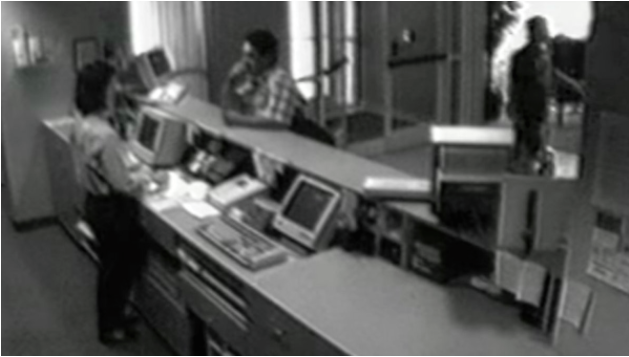 Surveillance footage of Blair purchasing a room at the Fairfield Inn.