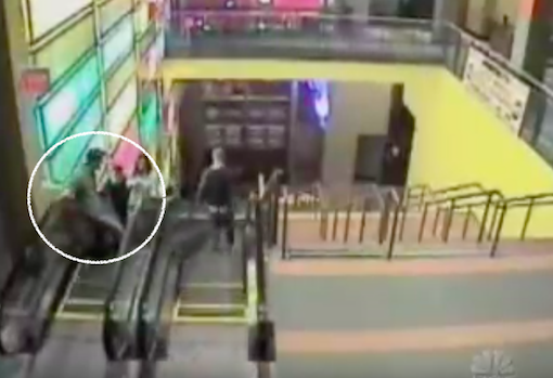1:15am - Brian, Clint and Meredith on the way up the escalator. Brian is in front, leaning on the handrail.