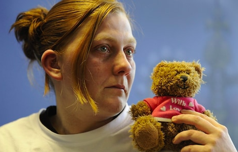 Karen Matthews holding the teddy bear (Source: The Telegraph)