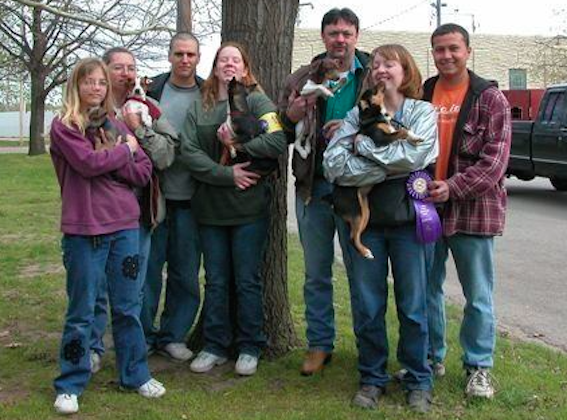 A group shot from the dog show in Abilene, Kansas. Lisa Montgomery (second from left), Bobbi Jo (second from right) and Zeb Stinnett (far right) pose with their dogs.
