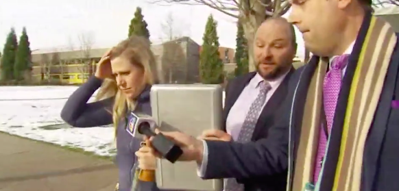 Julia, pictured with her lawyer, dodges questions from the media about her son’s disappearance (source: King-TV Seattle)