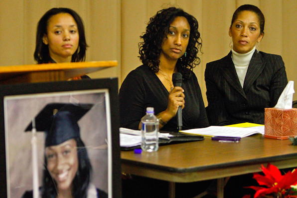 Latice Richardson (center) at a press conference (source: here)