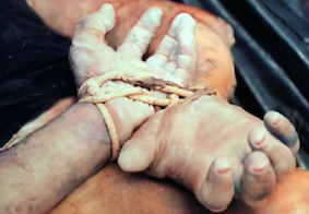 The victims’ wrists were bound behind their backs with yellow rope (source: Wikipedia)