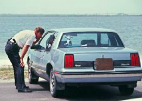 The Rogers’s ‘86 Oldsmobile Calais parked at the boat launch (source: Murderpedia)