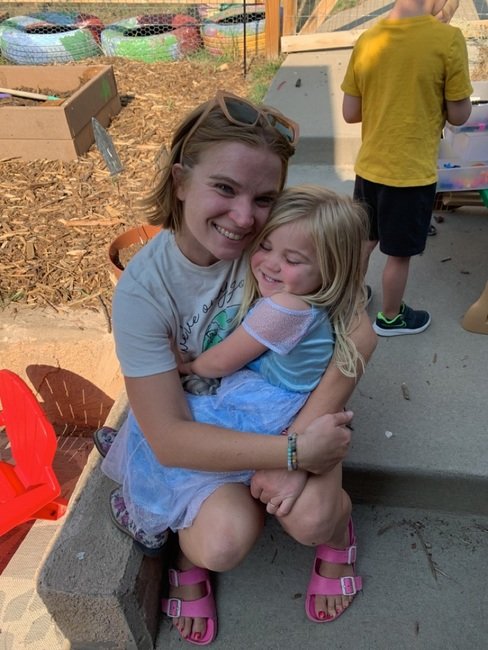 parent playing with children at preschool