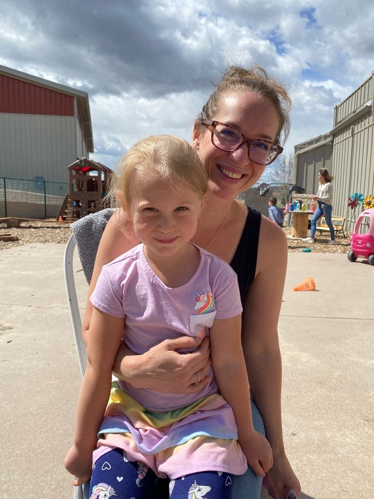 parent playing with children at preschool