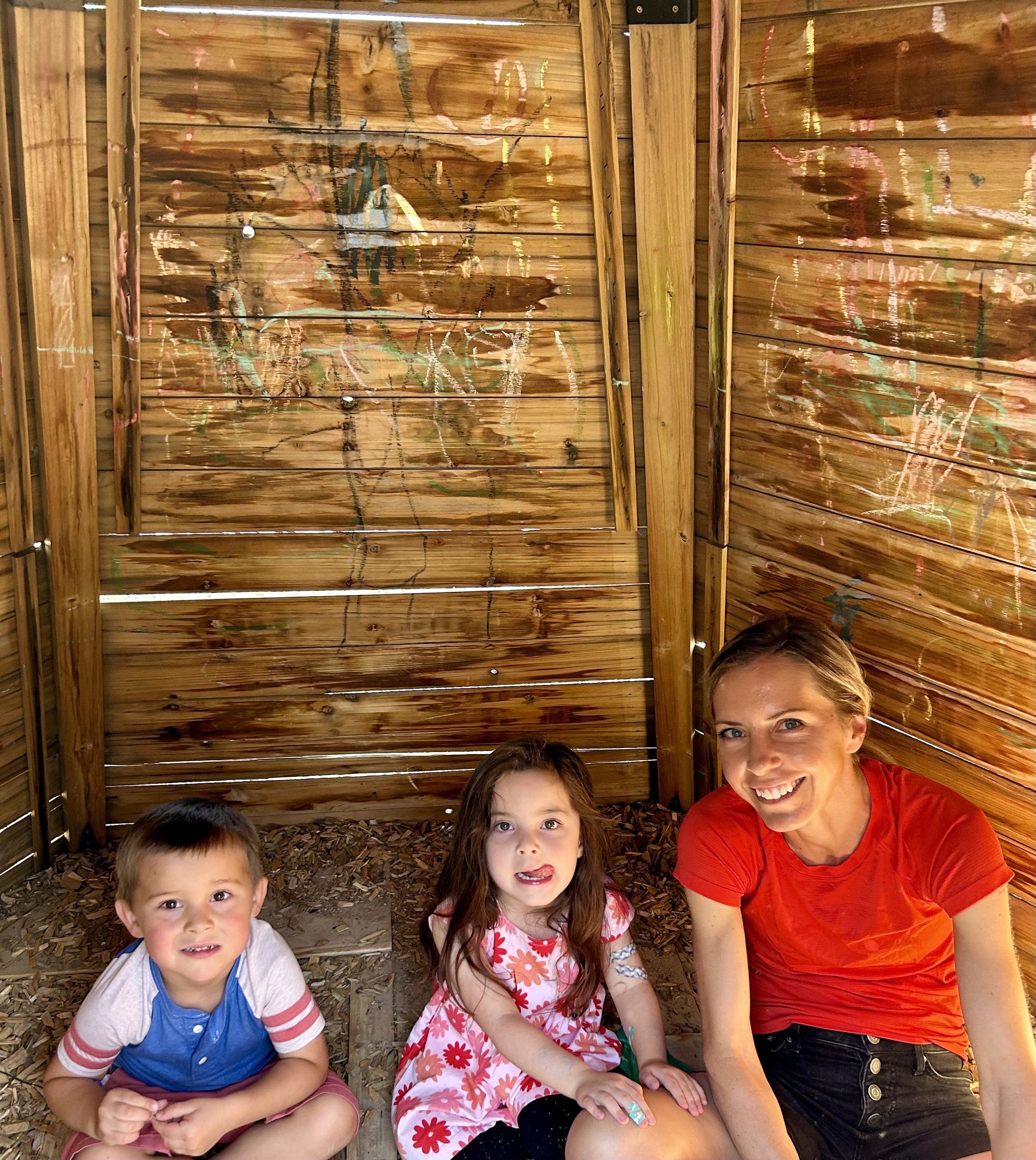 parent playing with children at preschool