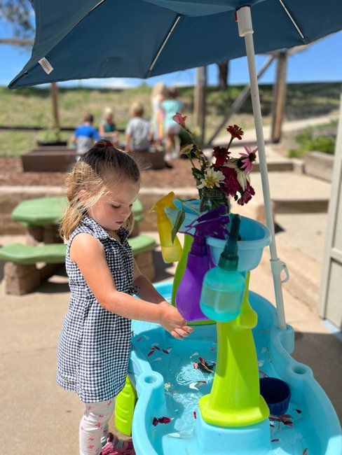 girl doing art at preschool