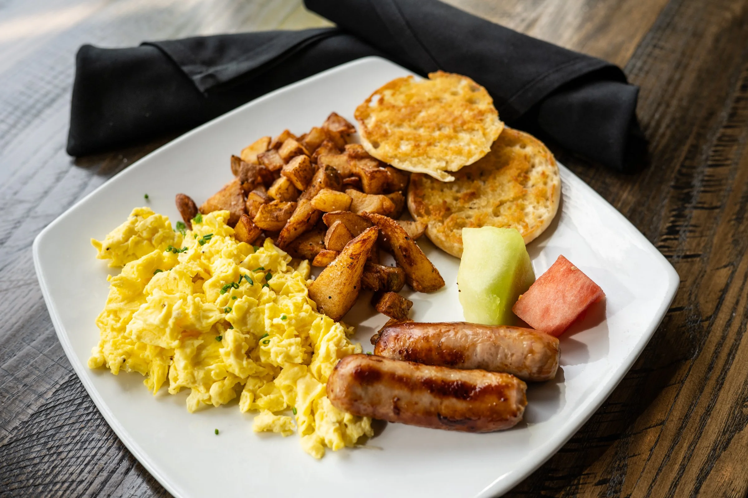 the classic breakfast gfa | 18  three eggs scrambled, choice of sausage link, apple-wood bacon, or canadian bacon steak, herb-roasted potatoes, choice of toast 