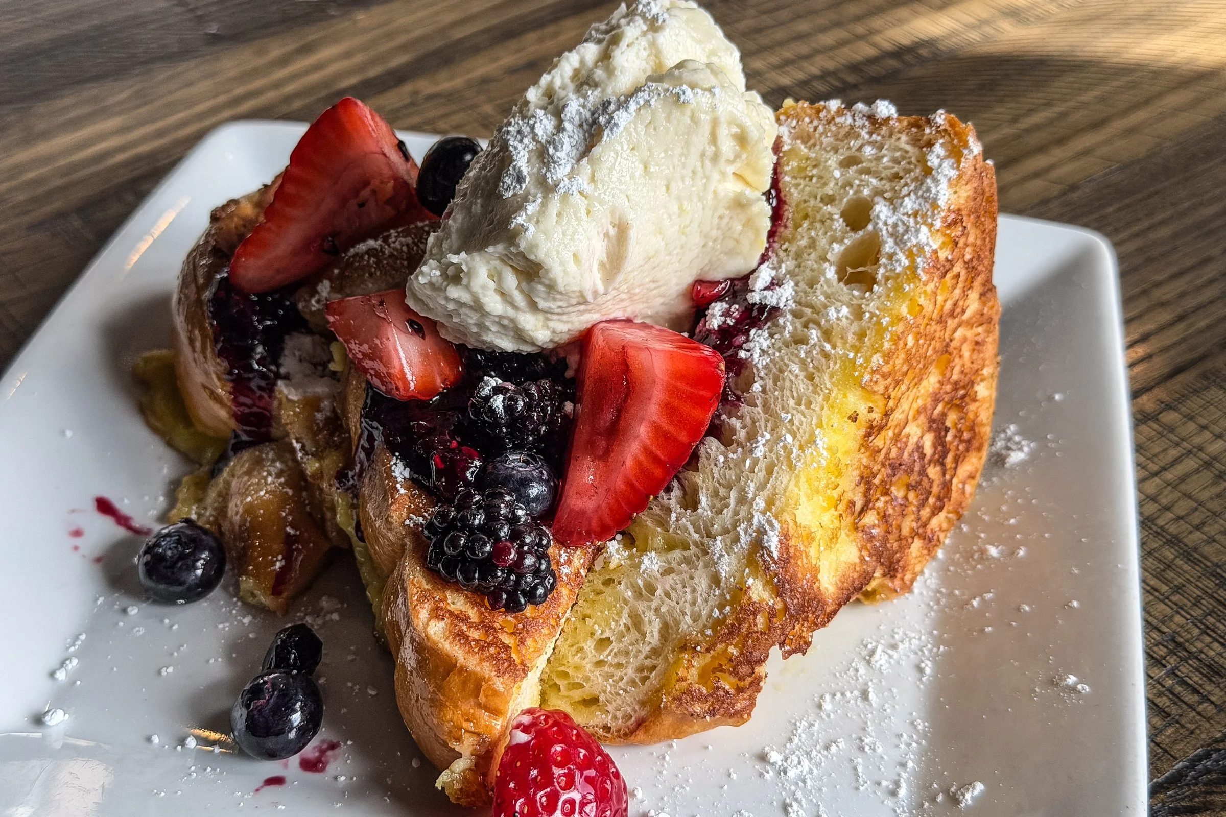 thick cut brioche bread, sweet vanilla cream,  lemon mascarpone mousse, wild berry jam,  fresh berries, powdered sugar