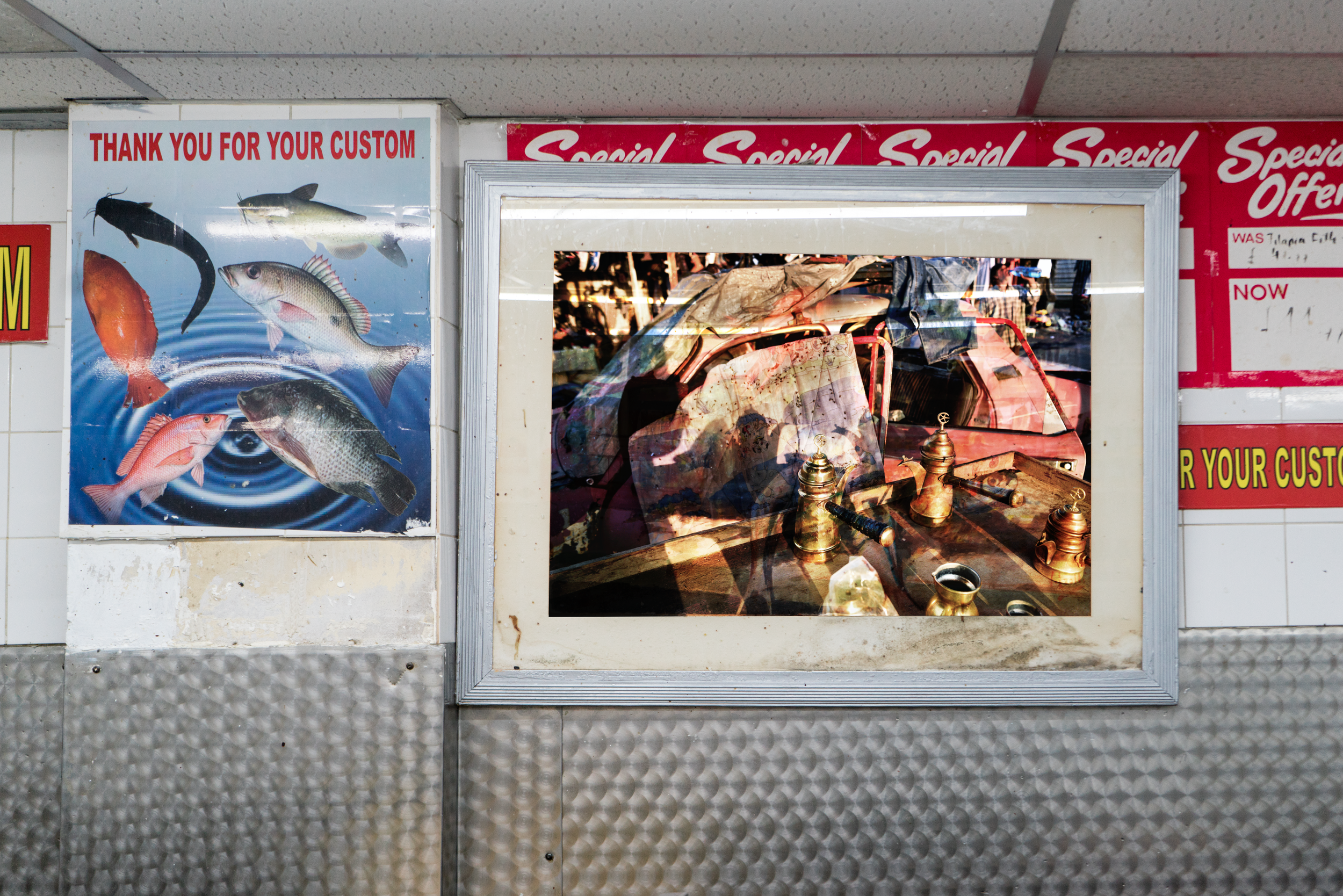  Photographed by Sophie Ellis and Madalena Botto. Installation of my photograph “Tradition Vanquishes Thirst,” inside a fish shop near Harlesden High Street Gallery.  