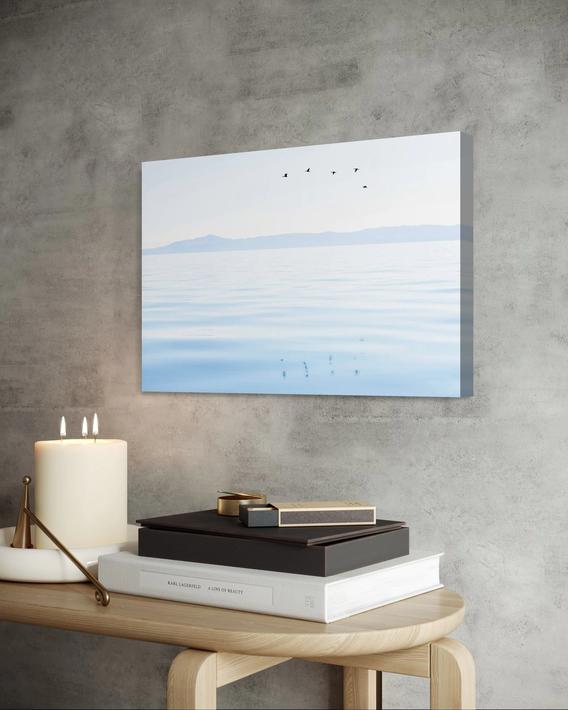 Calming photo of California shorebirds flying above surface of the ocean displayed in bedroom with natural light.