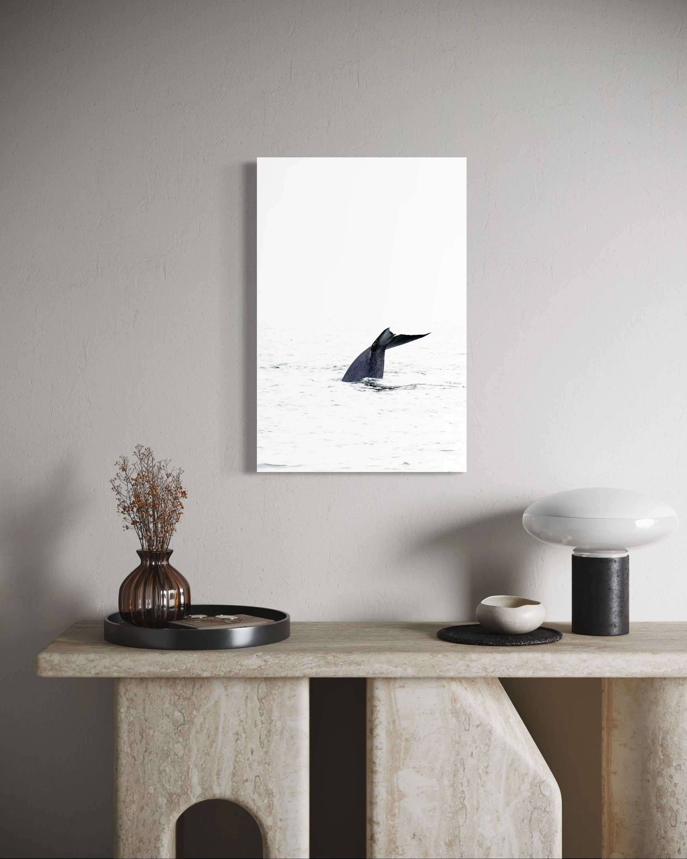 Dramatic blue whale photo displayed in contemporary bedroom with natural light.