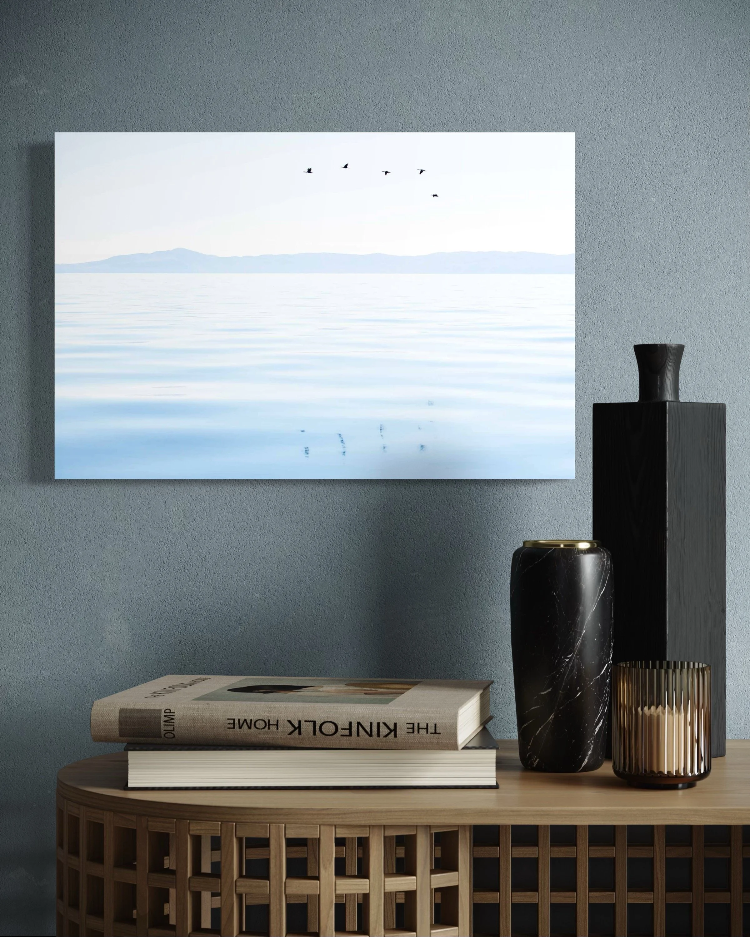 Calming sea bird photo displayed in coastal living room with natural light.
