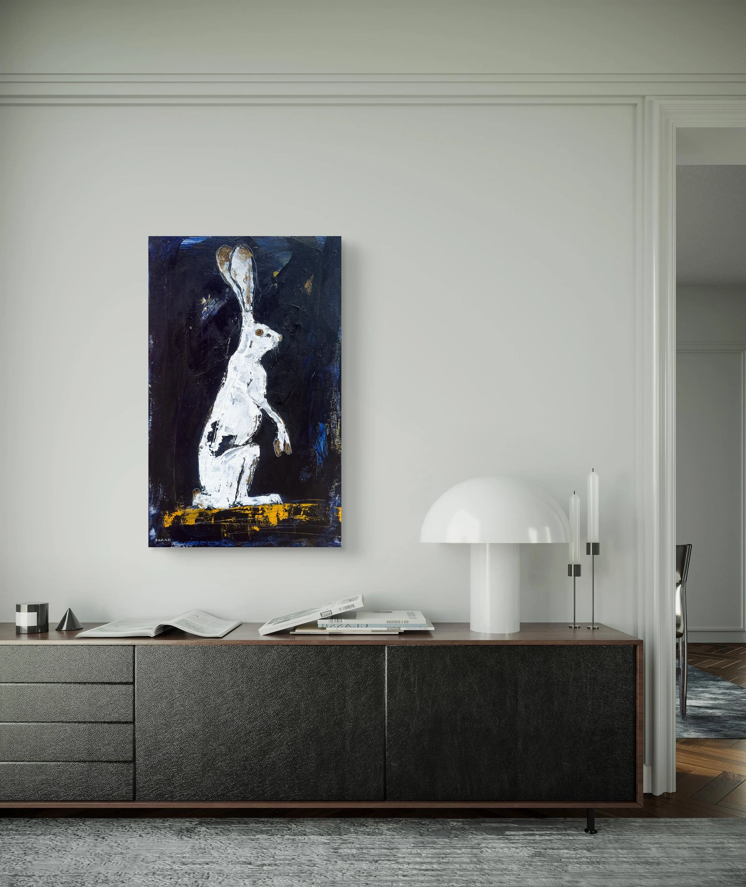 White hare acrylic wildlife art hung above dresser.