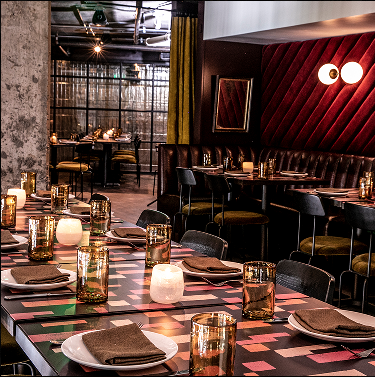 blue heron studio stenciled table tops at iberian pig buckhead. image courtesy of the iberian pig