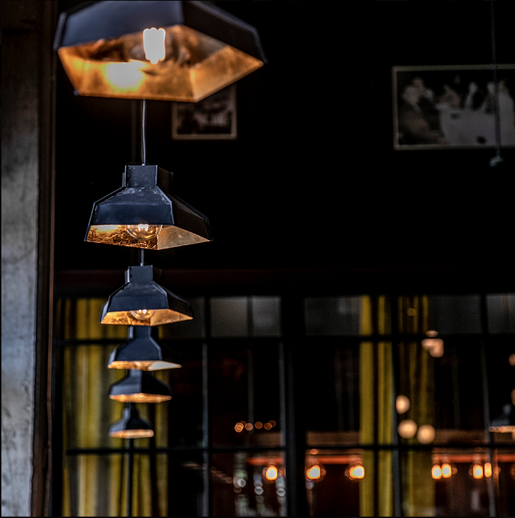 blue heron studio gilded pendants at the iberian pig buckhead. photo courtesy of the iberian pig