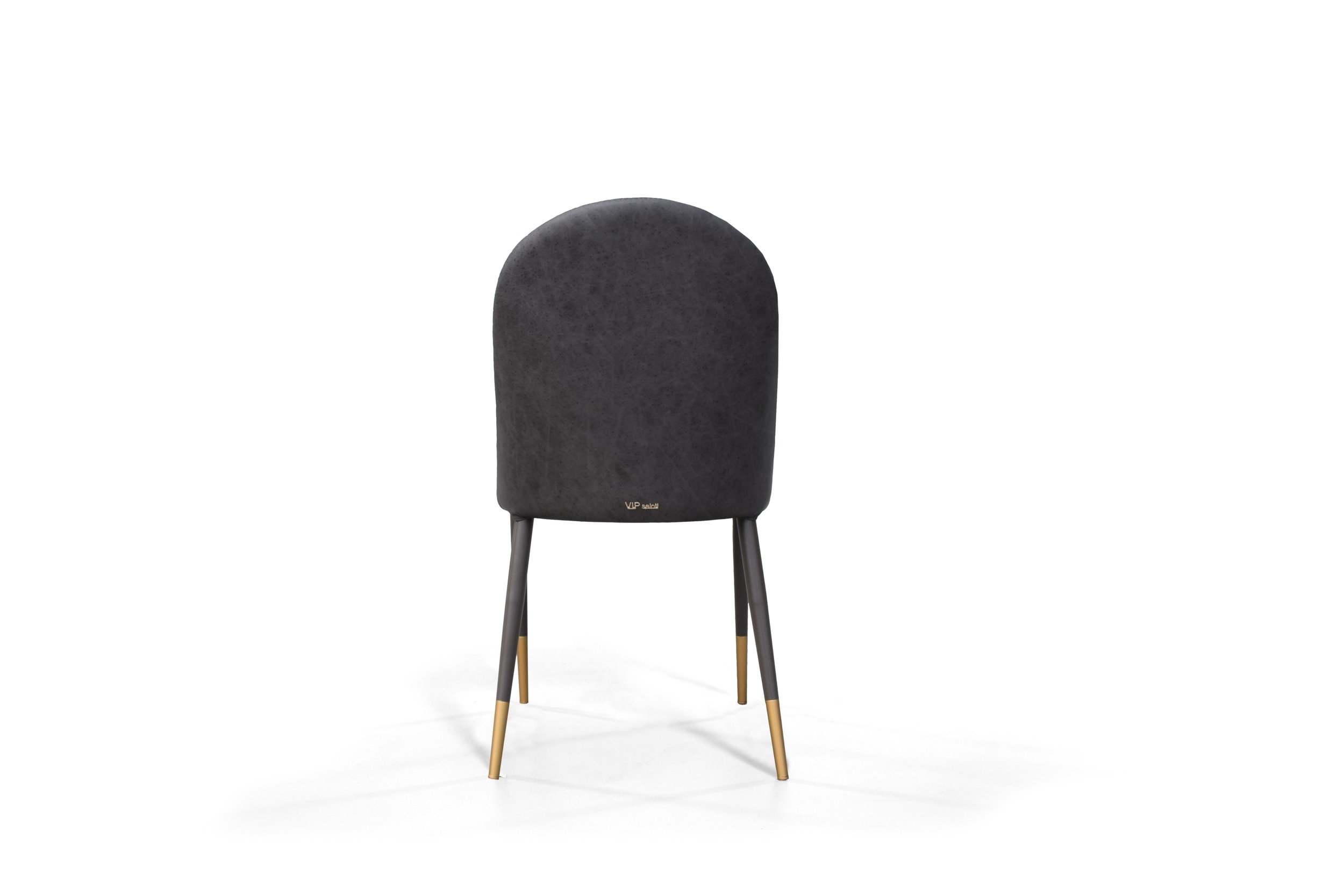 Back-side view of Adele modern dining chair in living room setting