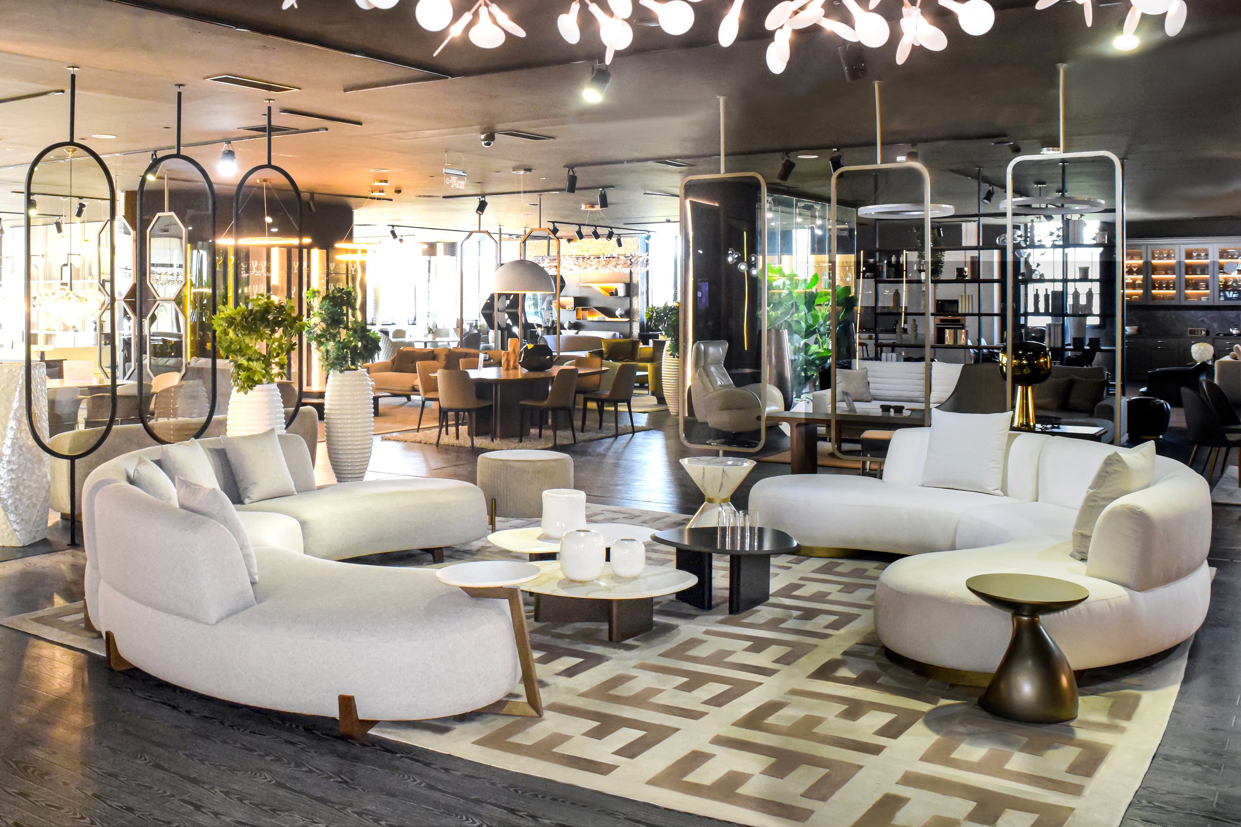 Designer hotel lobby featuring Linh modern curved sofas