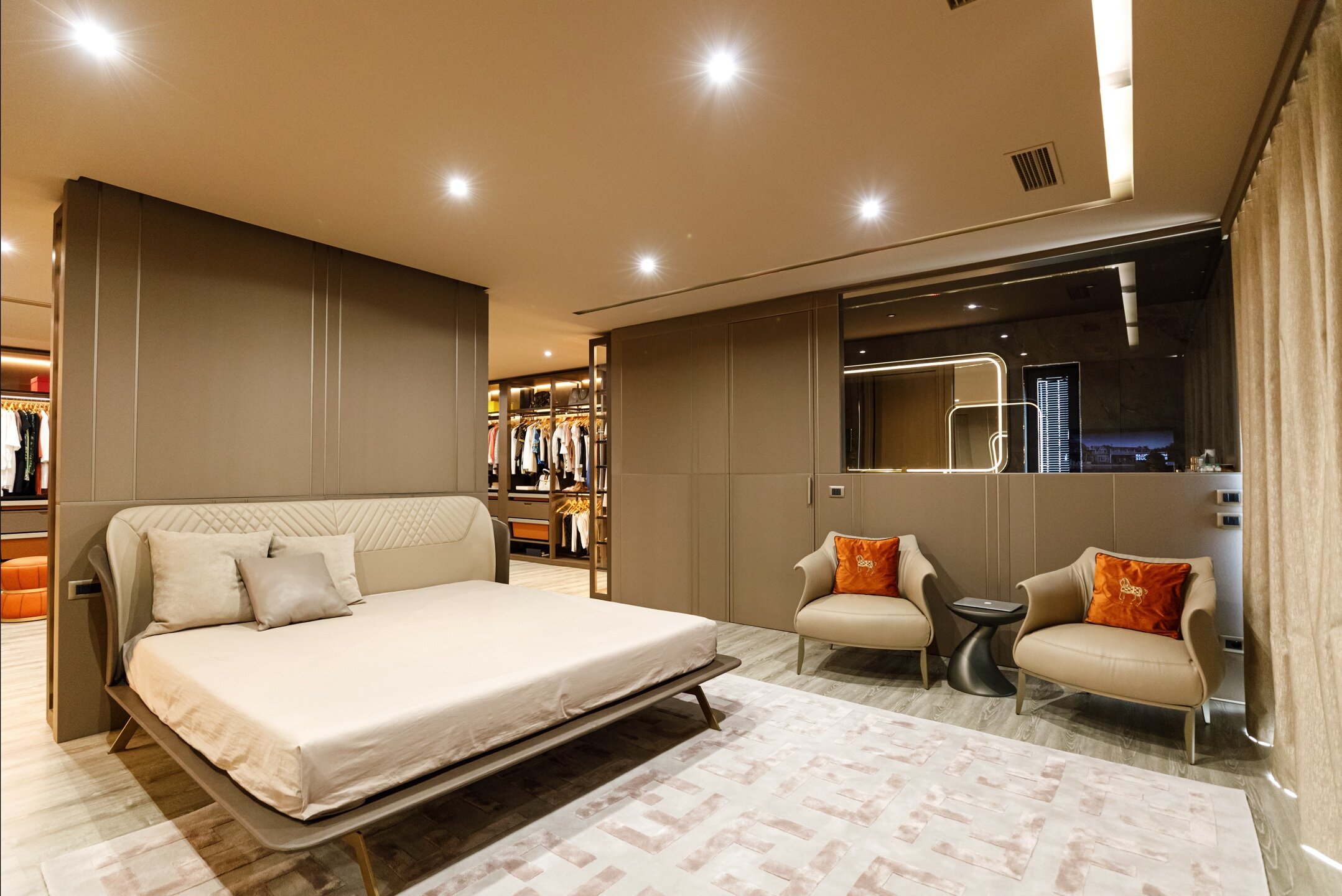 Luxury bed room featuring Amphora designer armchair