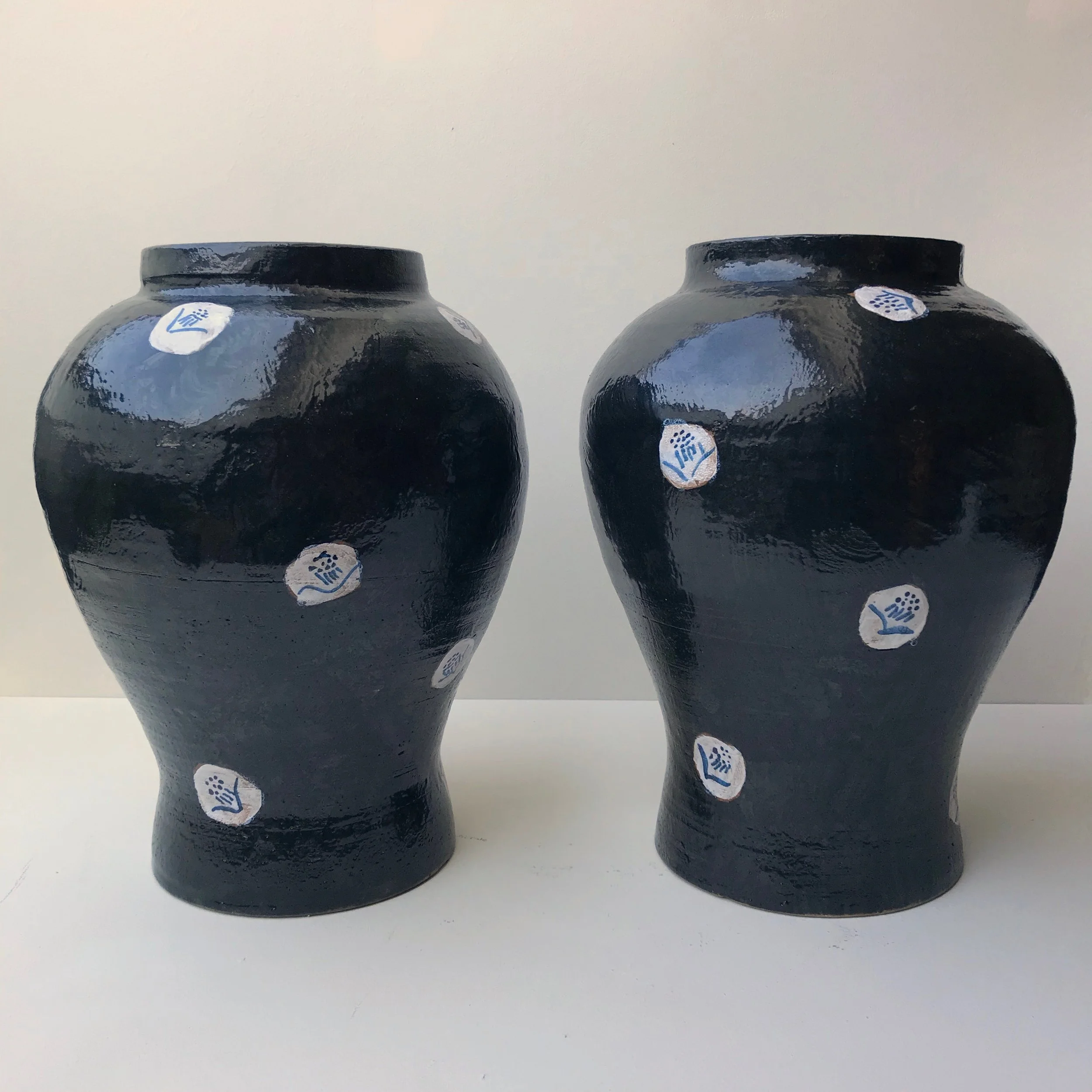 Pair of Black Vases with Blossom Design