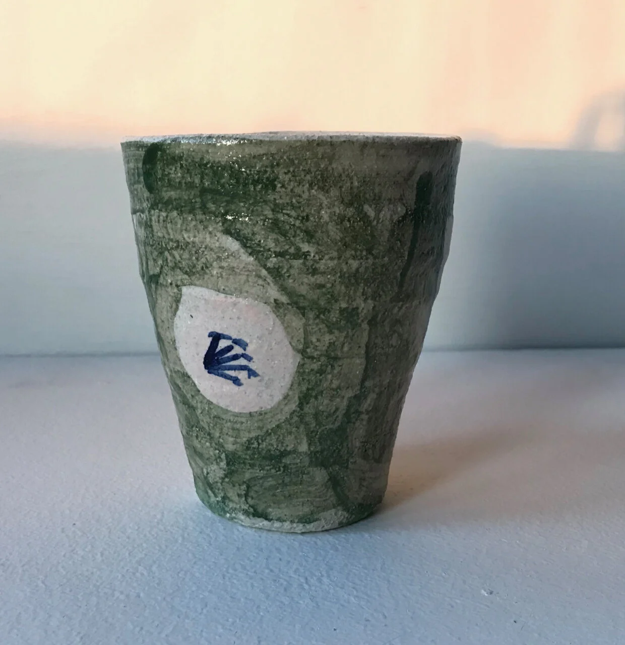 Green Cup with Blossom Design