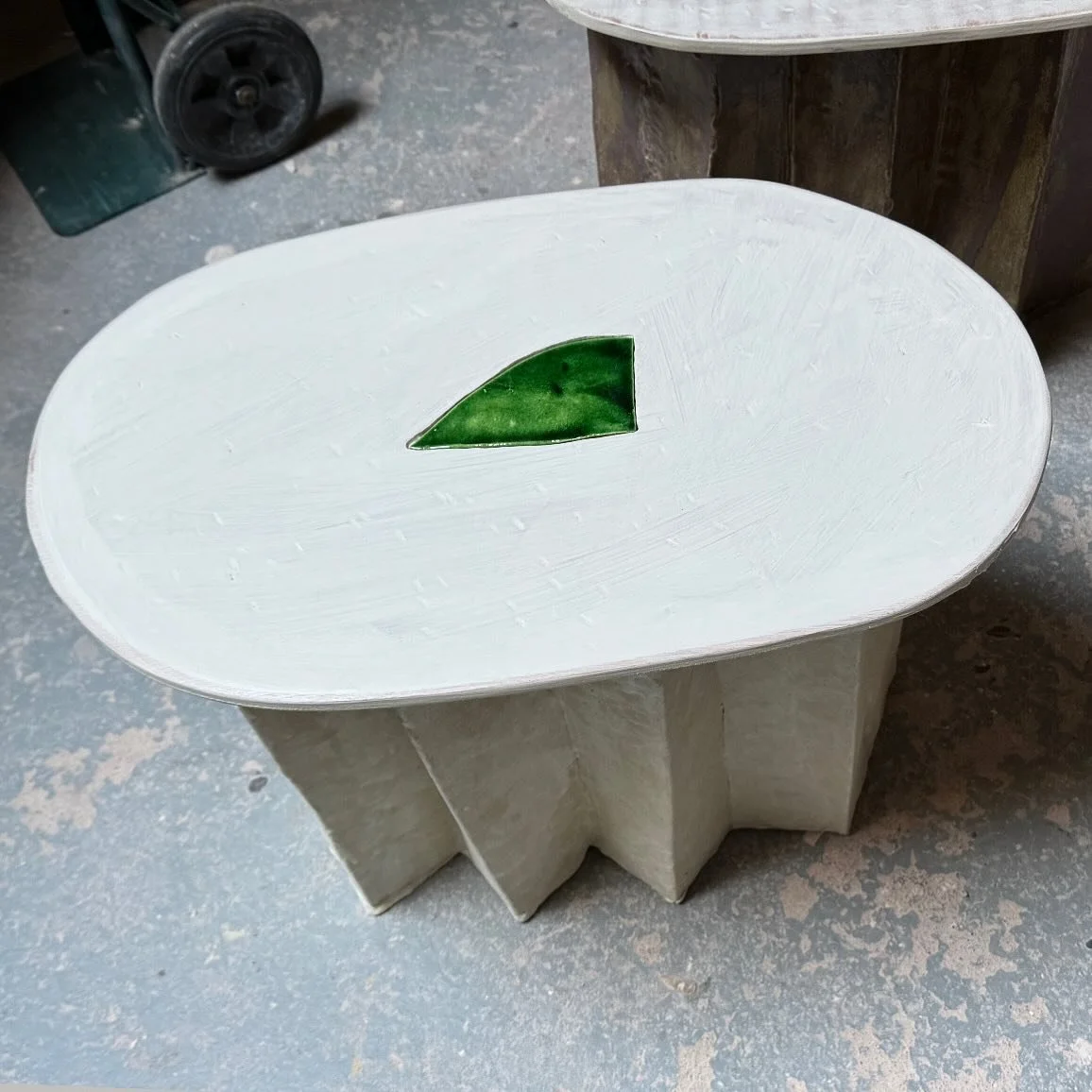 Glazed tile inlaid into milk painted wood, ceramic base.