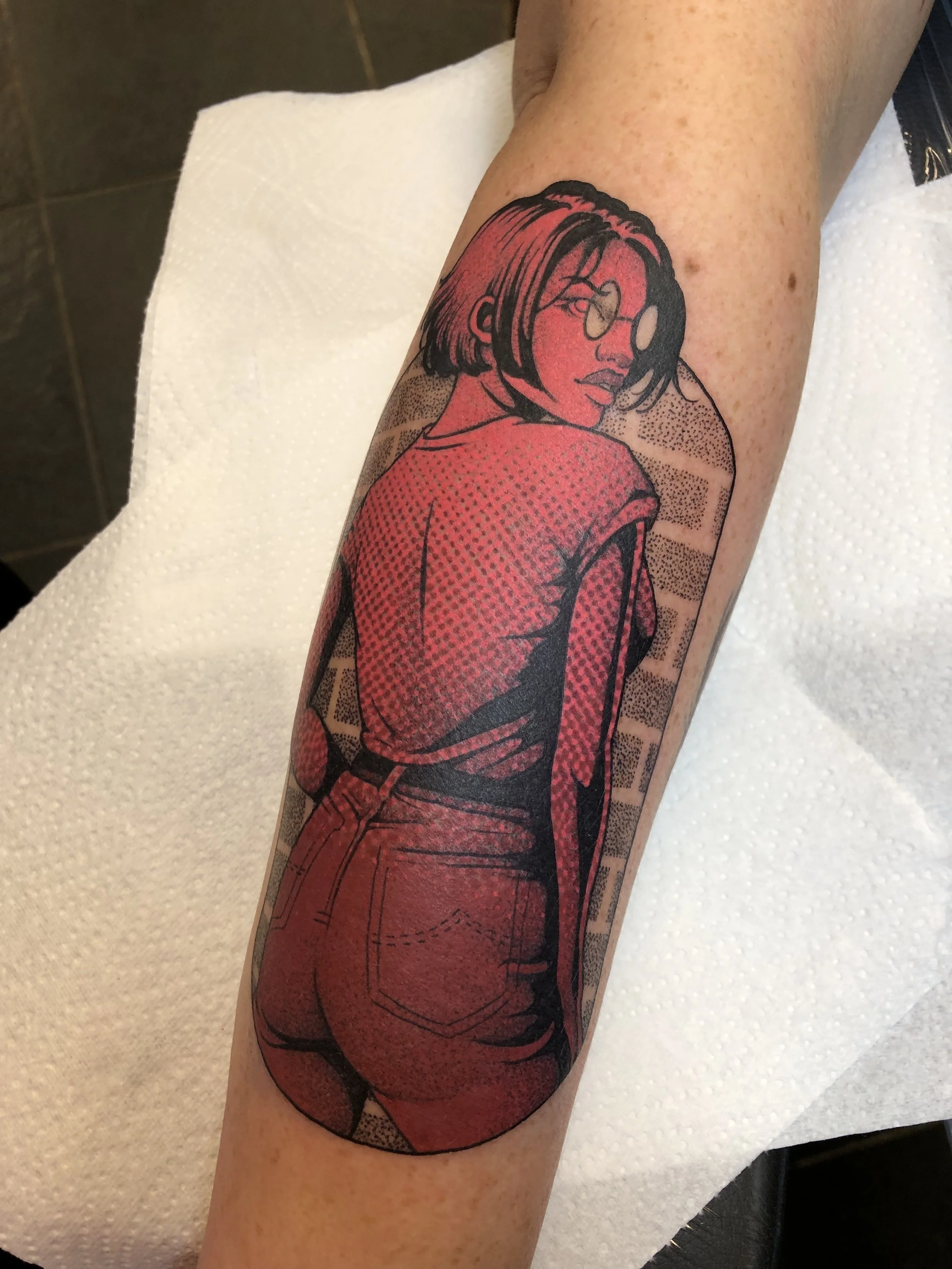 Comic book arm tattoo