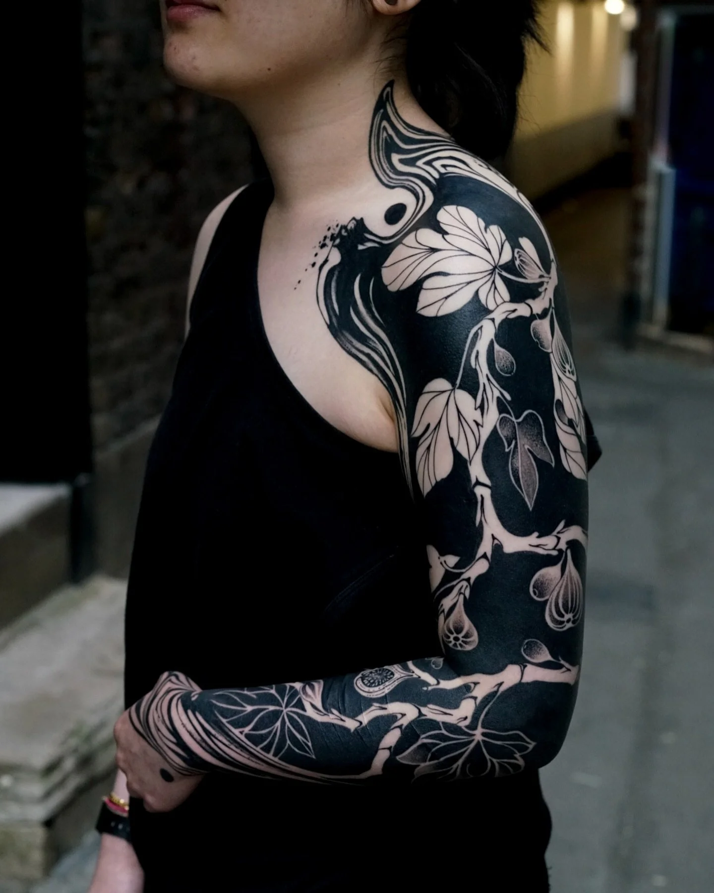 Full arm sleeve blackwork tattoo