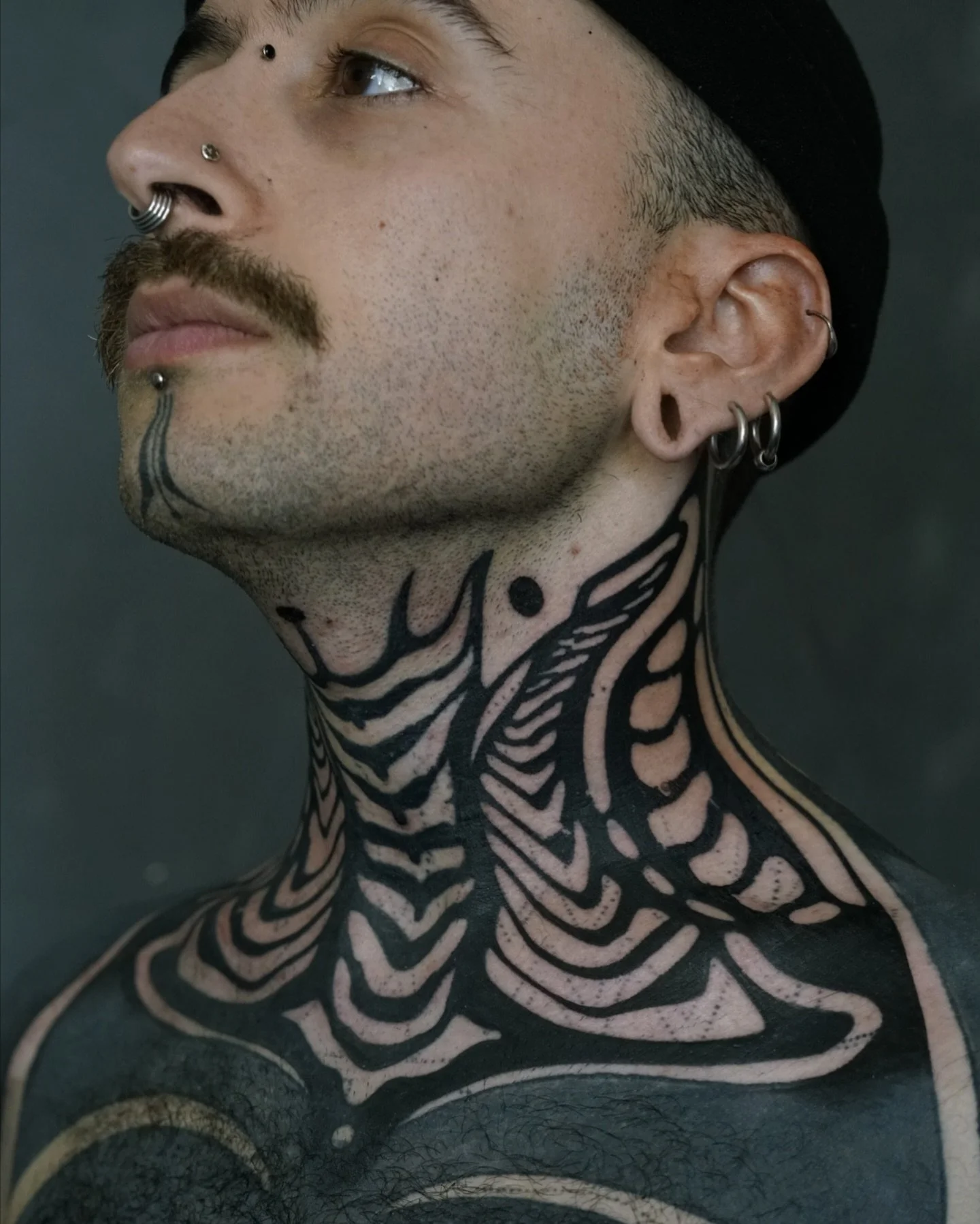 Blackwork neck tattoo in London