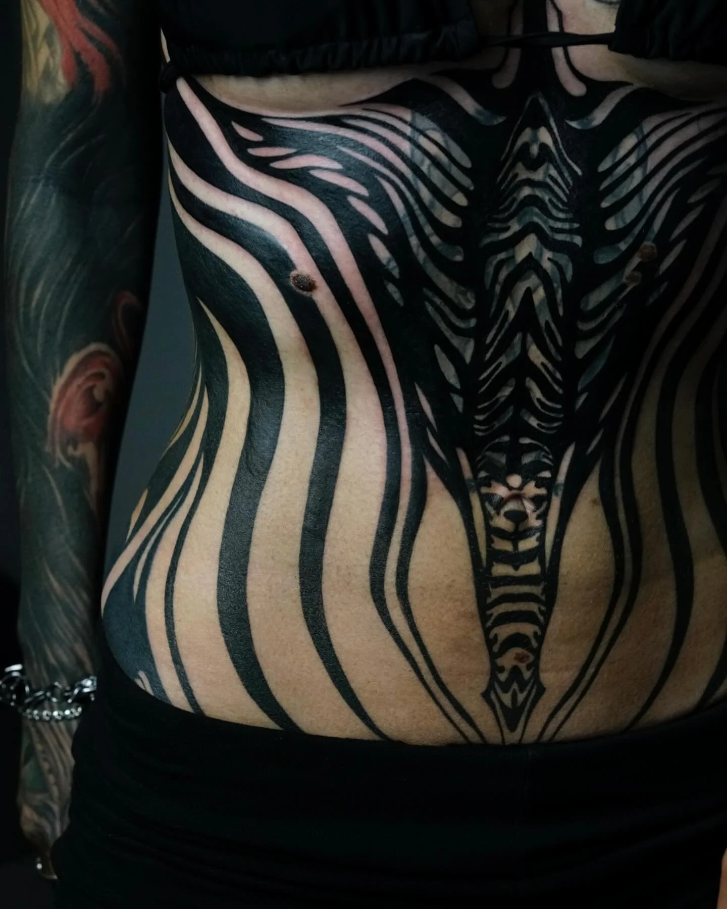 Full torso blackwork tattoo from Red Point Tattoo in North London
