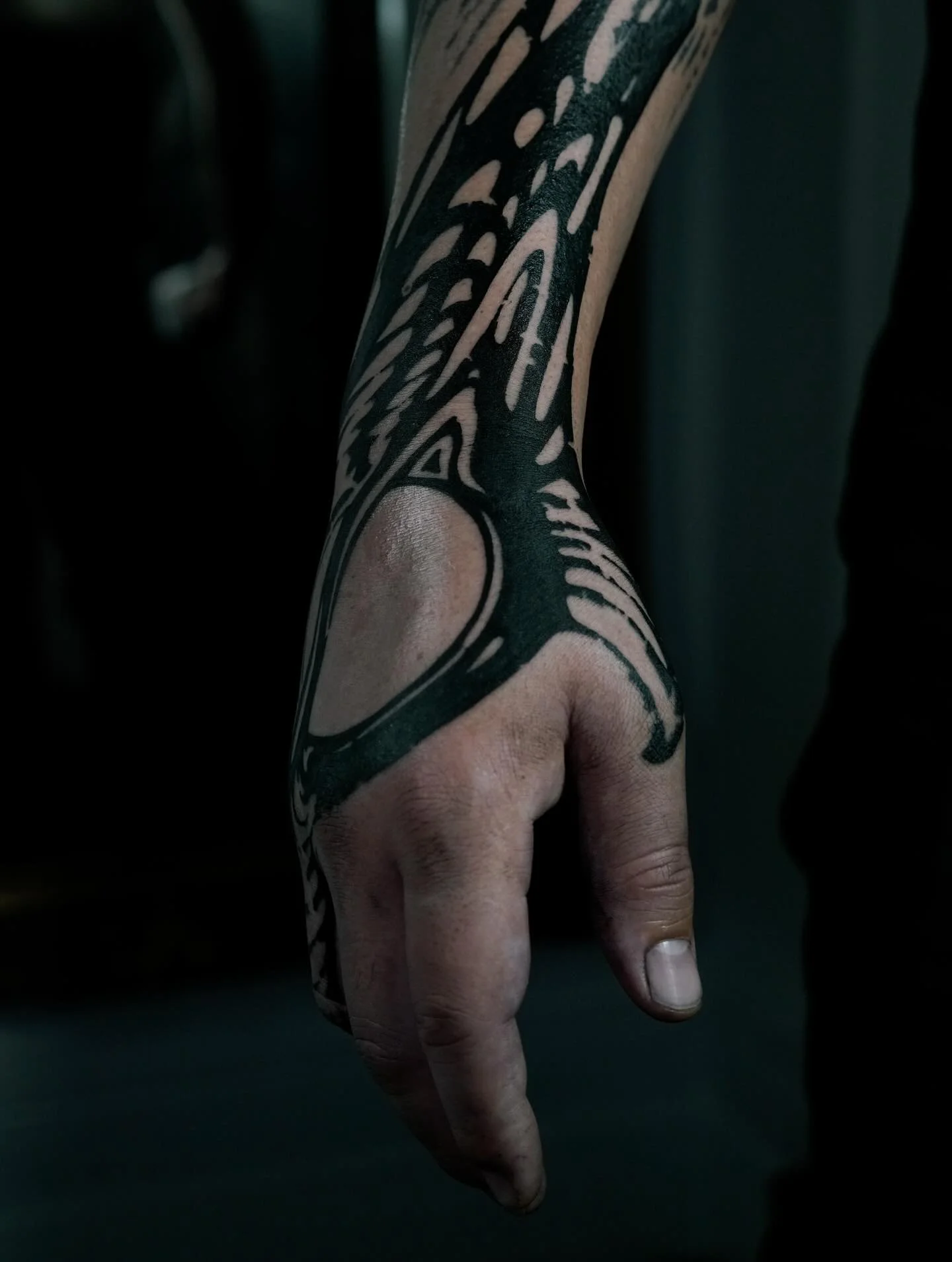 Wrist and hand blackwork tattoo