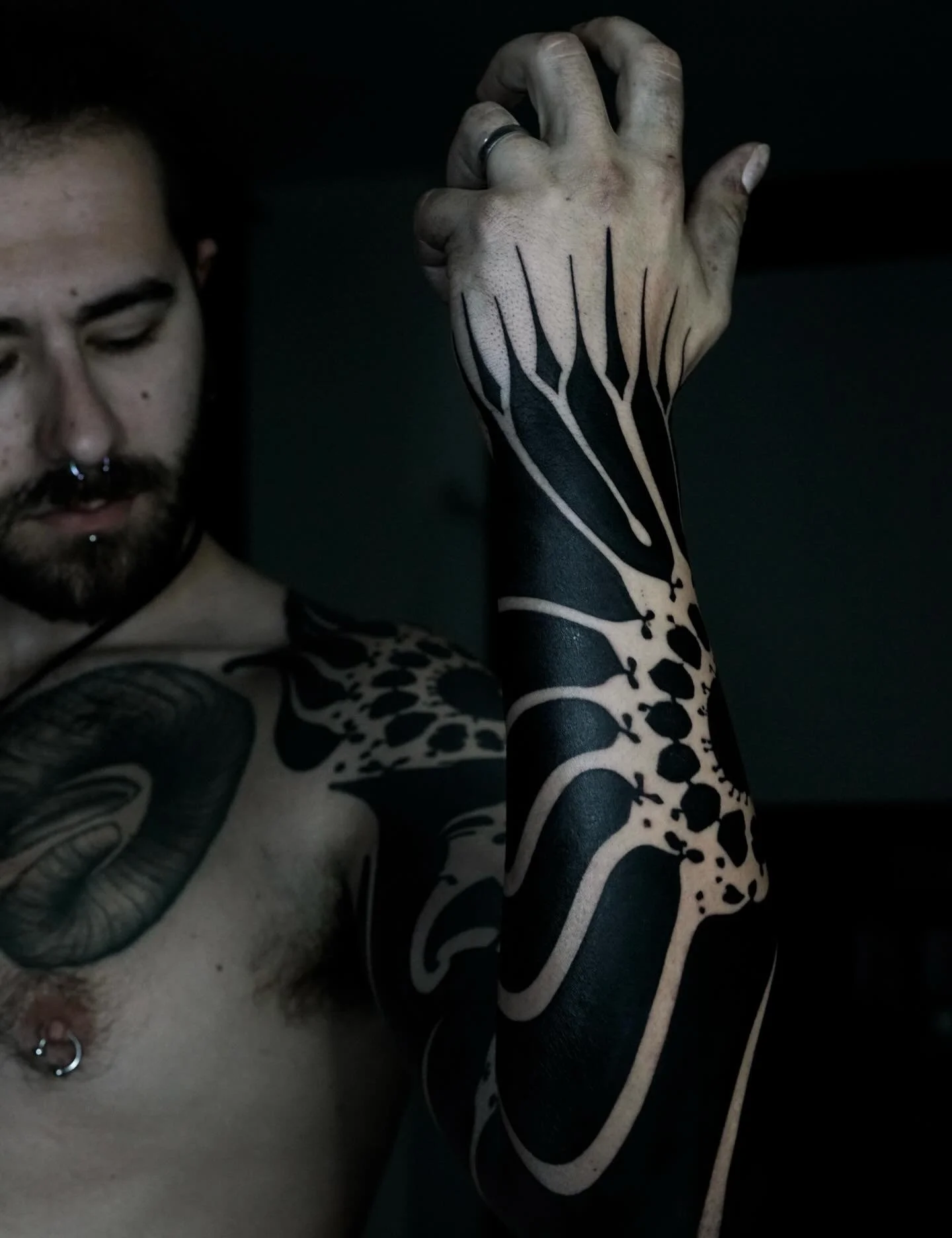 Blackwork geometric arm tattoo