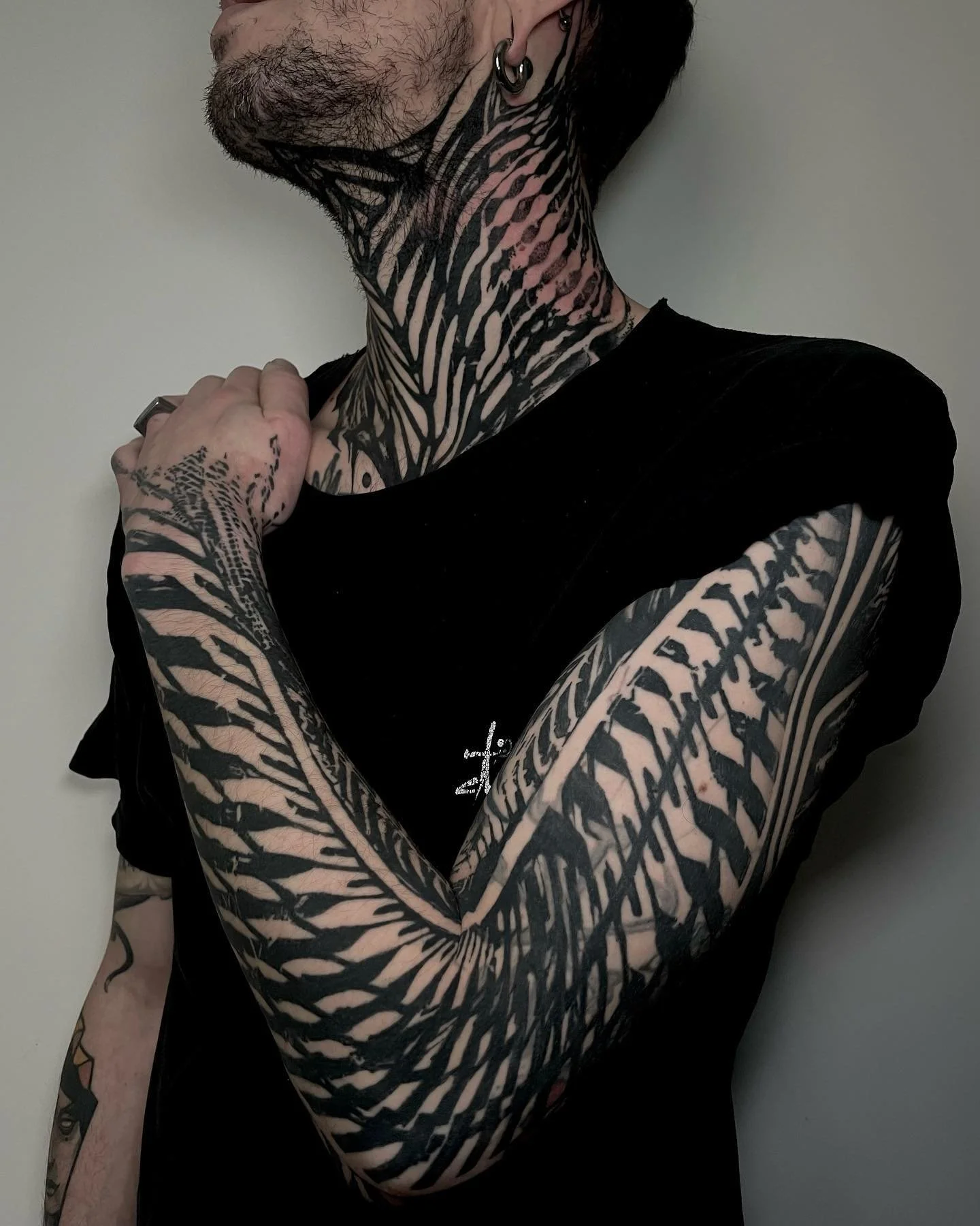 Arm and neck tattoo from Red Point Tattoo London