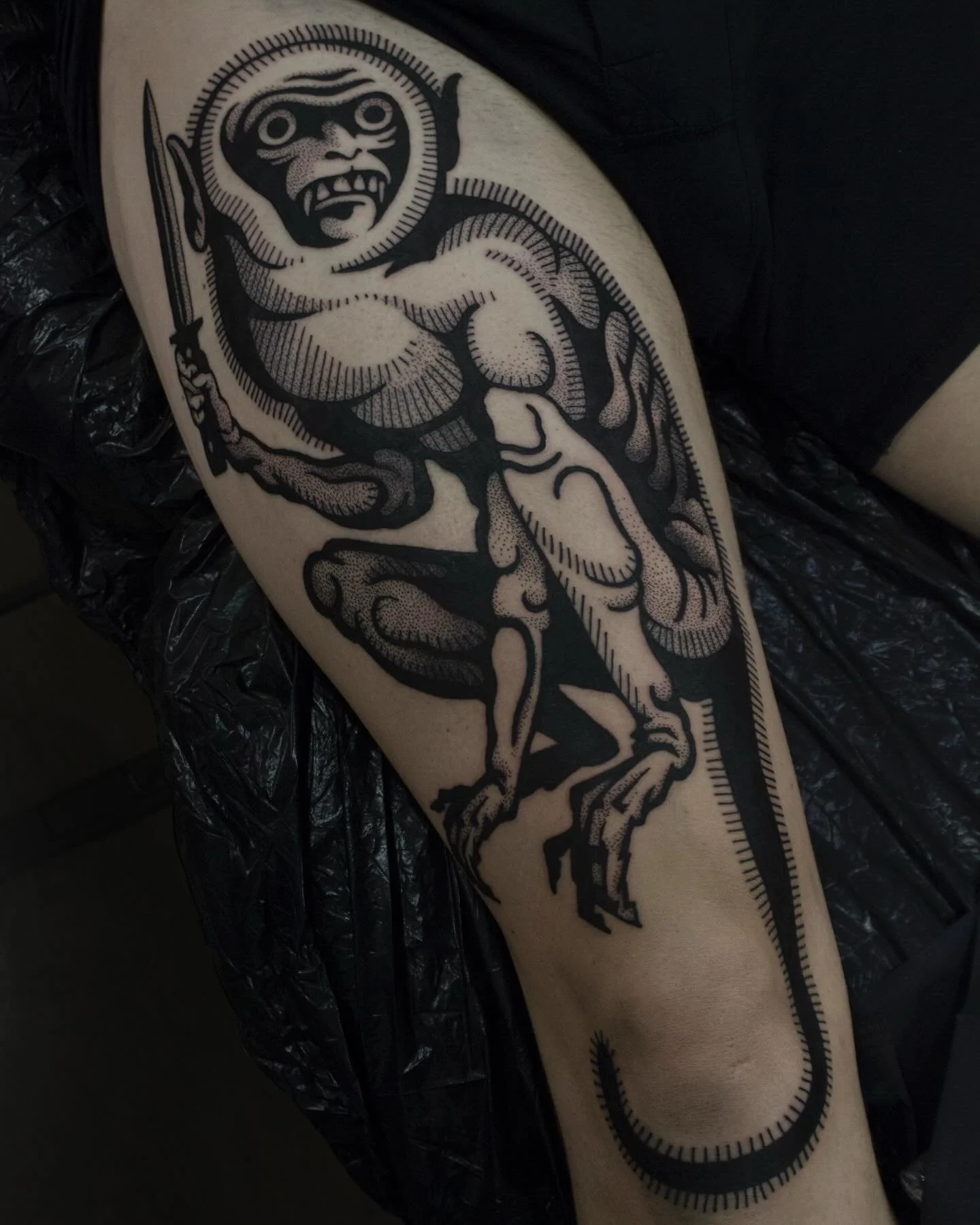 Blackwork monkey tattoo from Red Point Tattoo in London