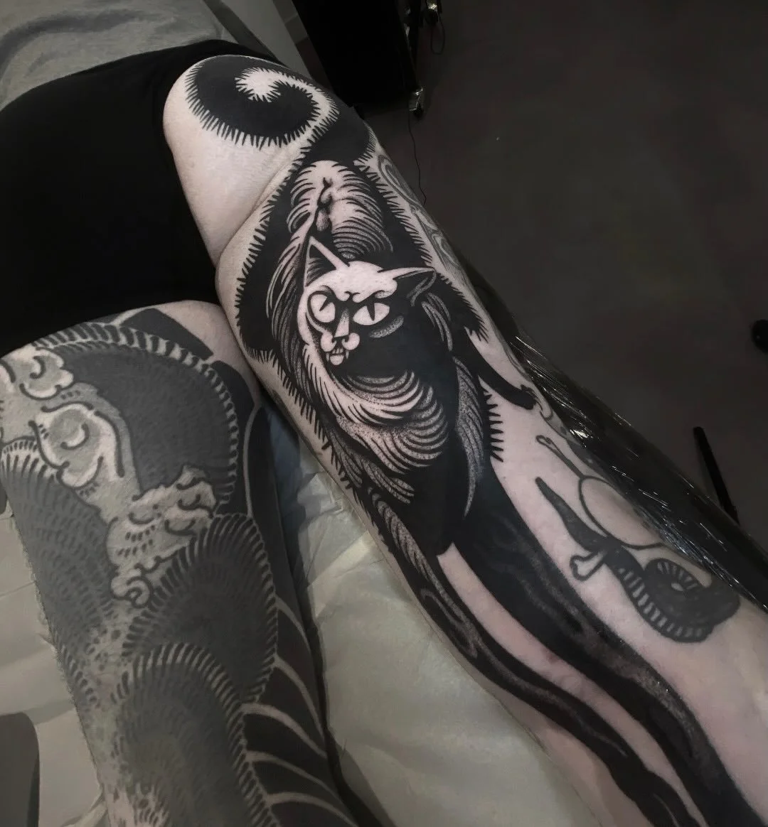 Black cat full leg tattoo