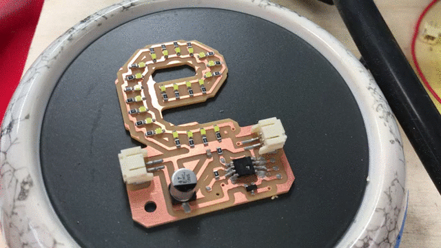 the PCB on the heating plate and heat gun applied over it