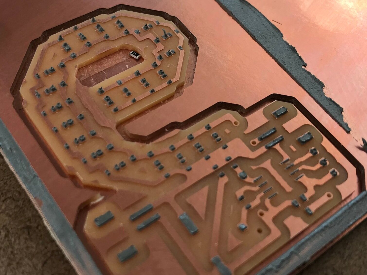 solder paste in place after swiping the paste over a stencil