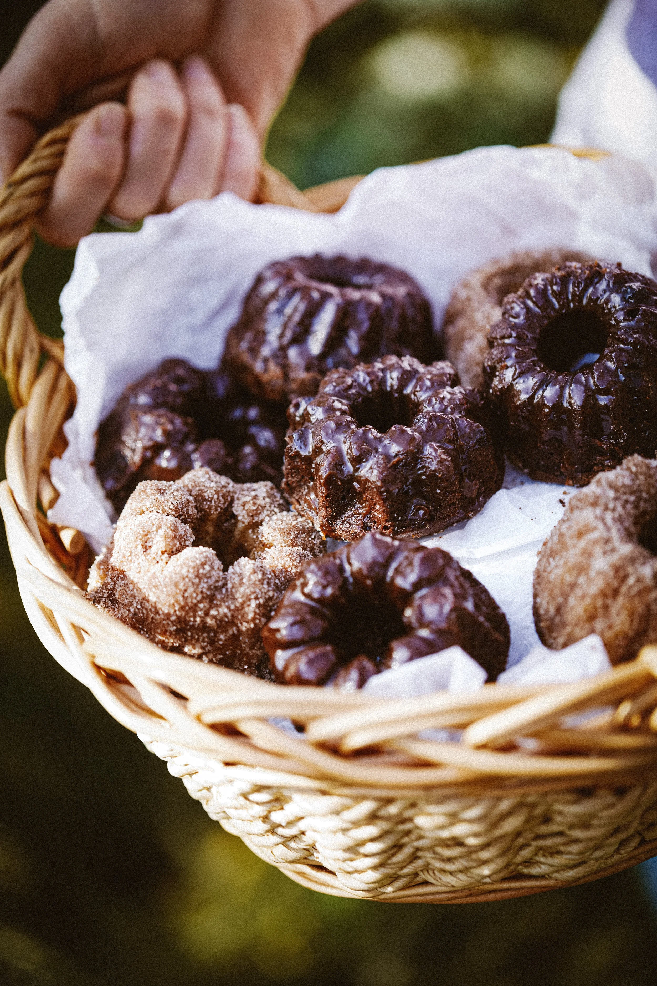 Image of a basket full of mini chocolate and cinnamon bundt cakes