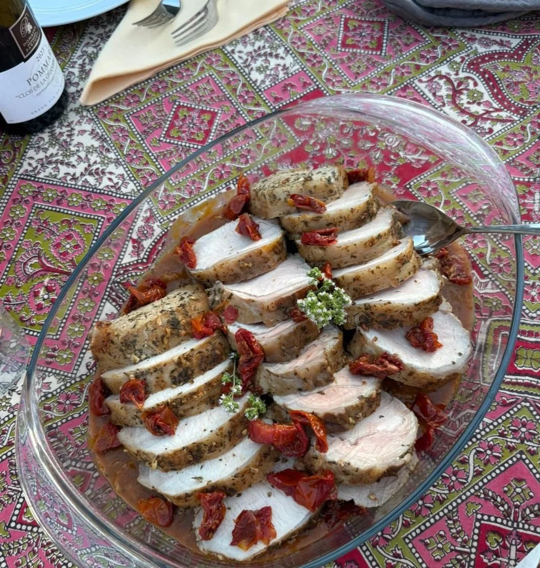 The Main Event Isn’t the Decor…
…It’s the pork tenderloin, honey.
Juicy. Herb-crusted. Roasted low and slow.
Laid out like artwork, and finished with sun-dried tomato jewels.
We don’t just plate food — we plate