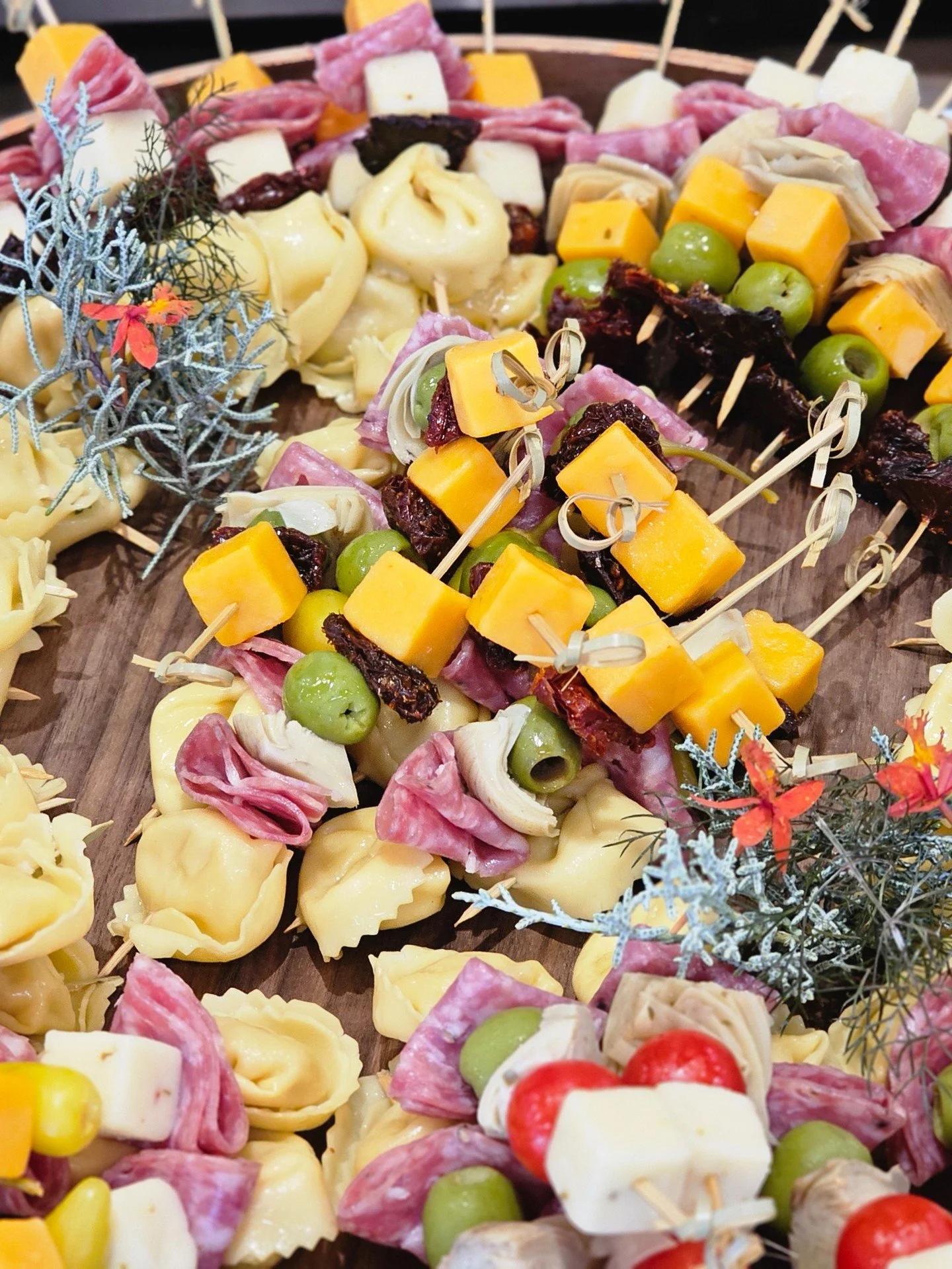 Cheese, salami, tortellini, olives, tomatoes&hellip; all skewered into a festive wreath of flavor.

🎁 This is how Busy Bee does charcuterie &mdash; holiday-ready and crowd-approved.
It&rsquo;s bold. It&rsquo;s colorful. And yes, it&rsquo;s completel