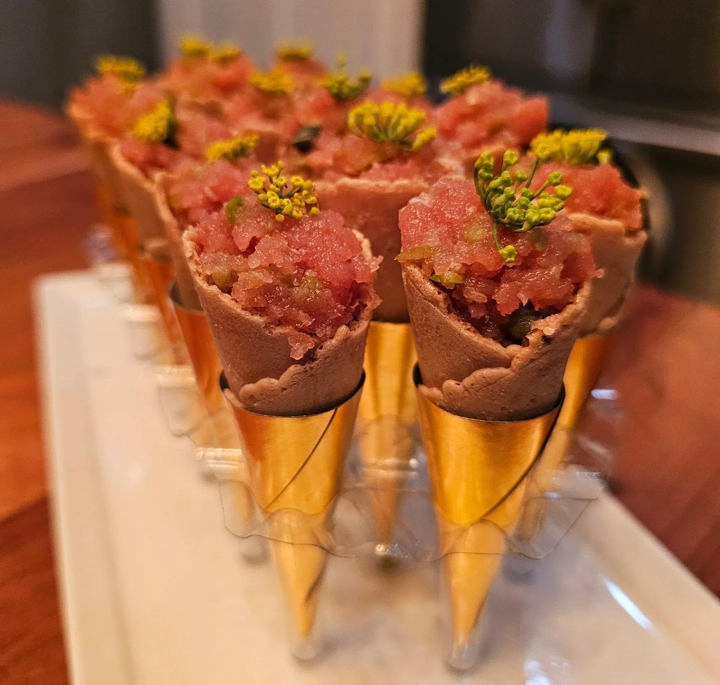 These aren&rsquo;t just hors d&rsquo;oeuvres. These are first bites that set the tone.
Crisp sesame cones, velvety tuna tartare, and a hit of citrus&mdash;because your guests deserve something unexpected and unforgettable.

🗓 Ring in the new year wi