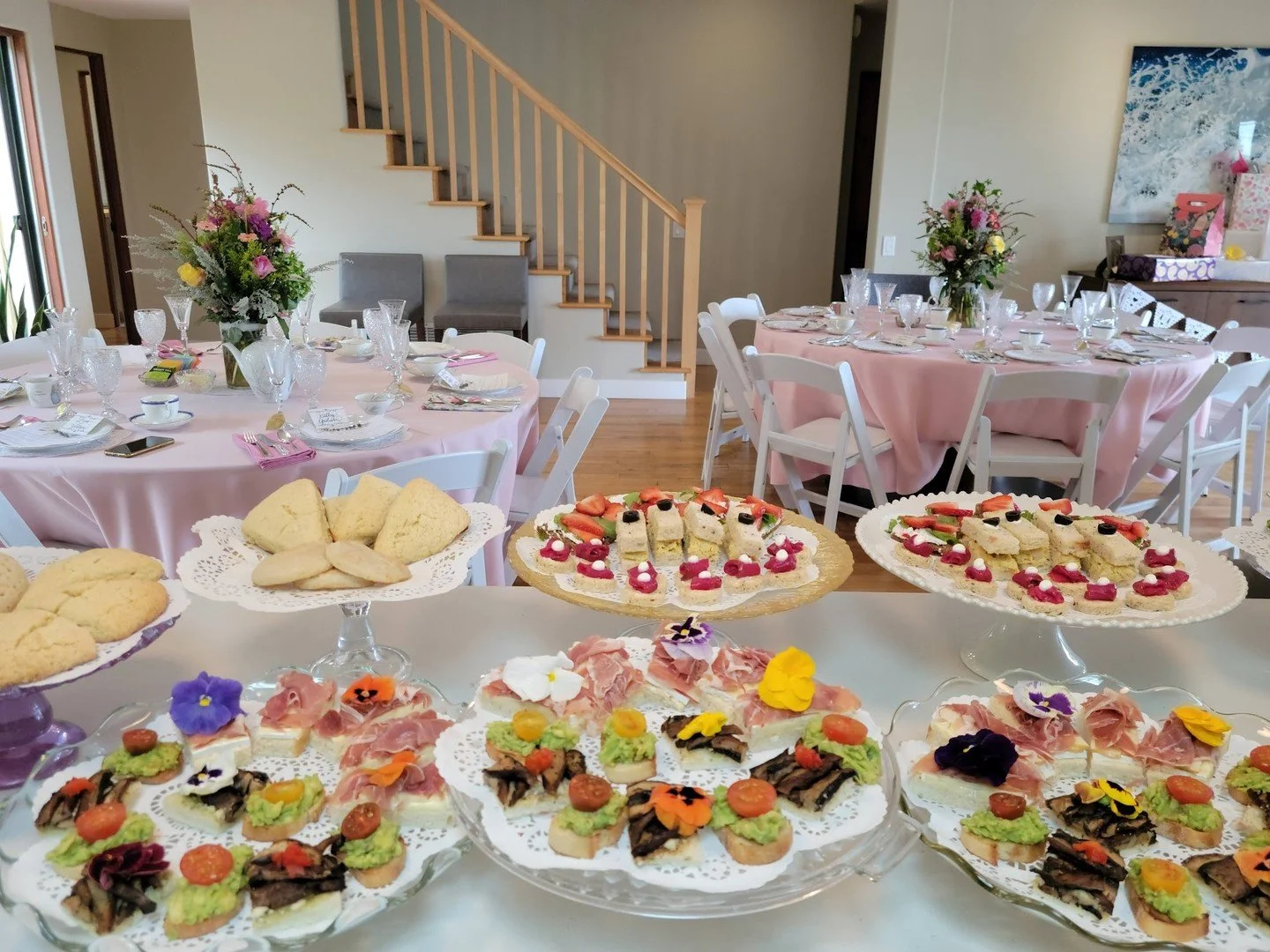 This isn&rsquo;t your average &ldquo;finger sandwich&rdquo; situation. This is a full-blown floral, feminine feast&mdash;layered with edible flowers, fresh bites, buttery scones, and tea service worth dressing up for.

✨ Perfect for bridal showers, b