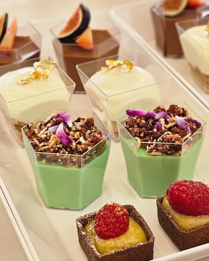 These aren&rsquo;t just desserts.
They&rsquo;re little edible celebrations.

Silky chocolate, pistachio cream, gold leaf accents, fresh berries, and handcrafted tartlets that disappear almost as quickly as they&rsquo;re served.

Because the final cou