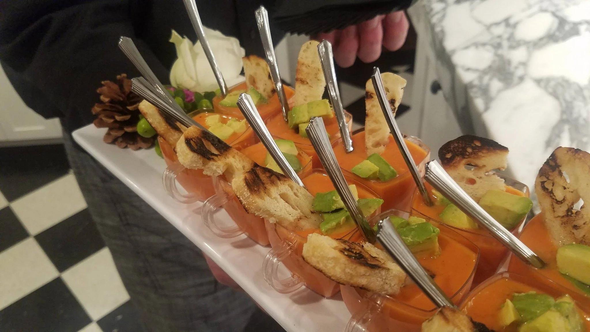 Passed appetizers that actually stop the room. 🍅🥑

Chilled gazpacho shooters topped with fresh avocado and charred crostini &mdash; elegant, easy to grab, and impossible to pass up. This is the kind of detail that makes your event feel curated, not